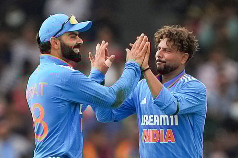 Kuldeep Yadav celebrates with Virat Kohli after taking the wicket of Charith Asalanka